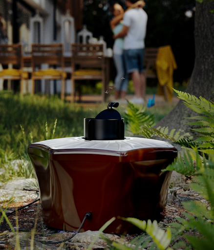outdoor mosquito trap in garden setting with blurred couple in background